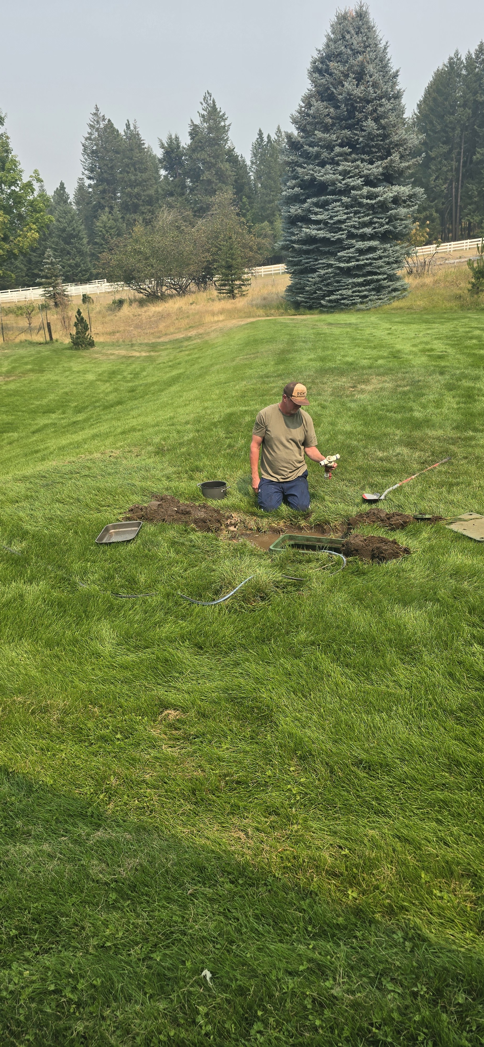 Robert troubleshooting a sprinkler system spin-down filter in North Idaho